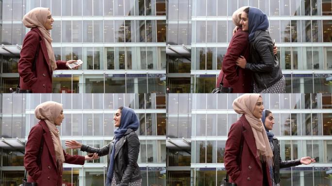 两名英国穆斯林妇女朋友在办公室外聚会