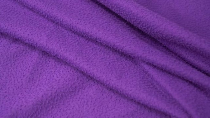紫罗兰色毛毯纹理背景。平底锅拍摄UHD 4k