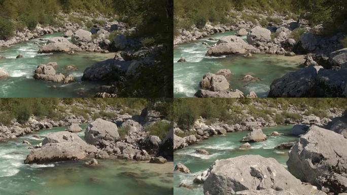空中，特写: 美丽的翡翠保持河流在尖锐的岩石之间奔跑