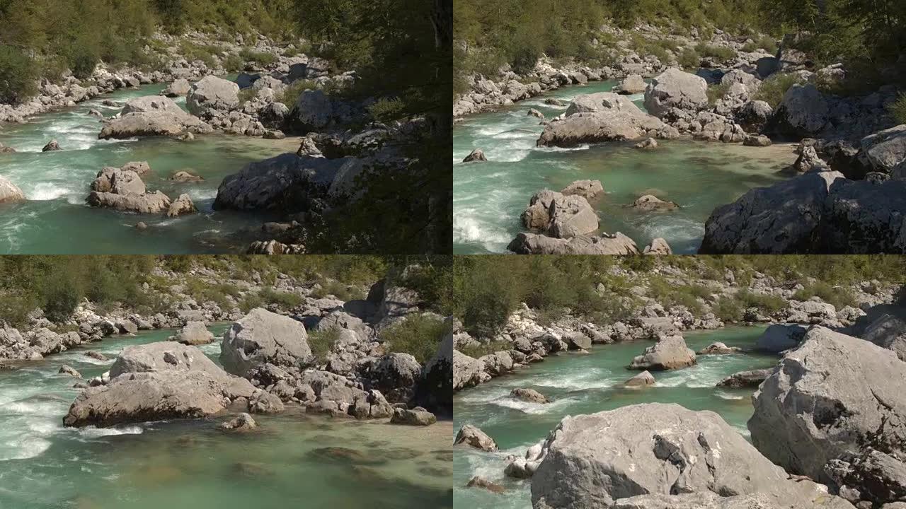 空中，特写: 美丽的翡翠保持河流在尖锐的岩石之间奔跑