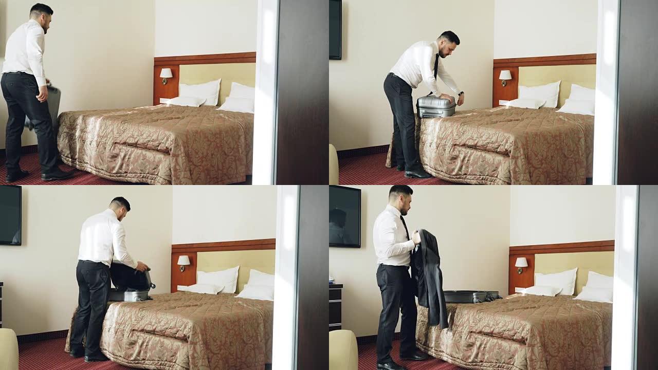 进入酒店房间的商人在办理入住手续后打开行李箱，穿上夹克。旅游、商务和人的概念