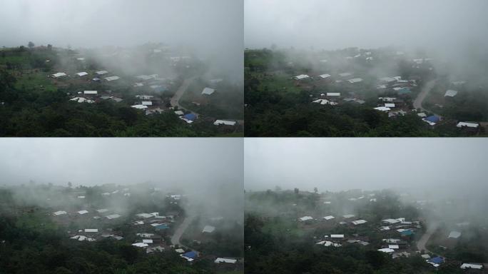 4k，带村庄的山雾鸟瞰图。