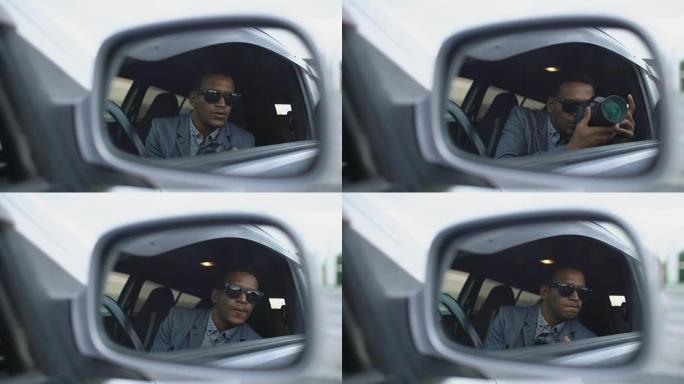 坐在车内用单反相机拍照的警察侧镜反射