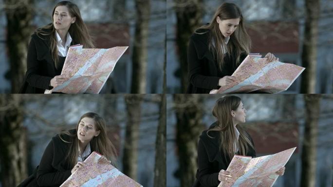 高清: 绝望的女商人看着地图