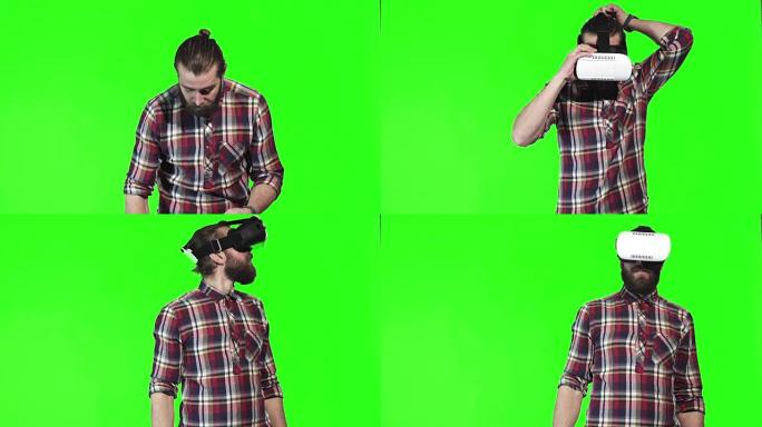 大胡子男子在绿屏上戴着VR谷歌