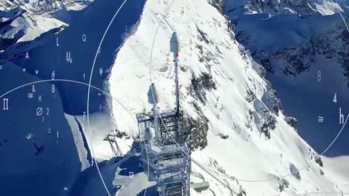冬季山峰上的通讯塔象征着全球通信和监视