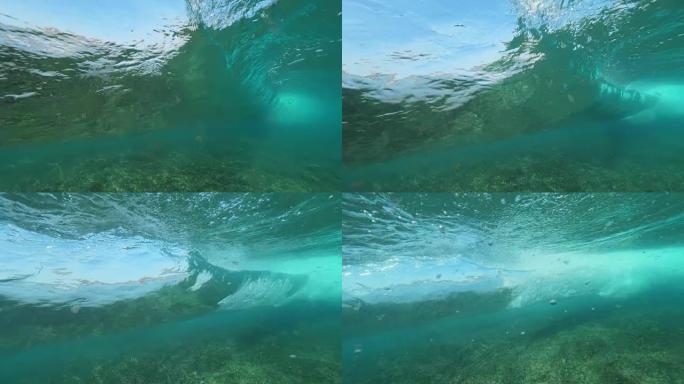 水下慢动作: 在深蓝色的海洋中形成令人着迷的桶形波。