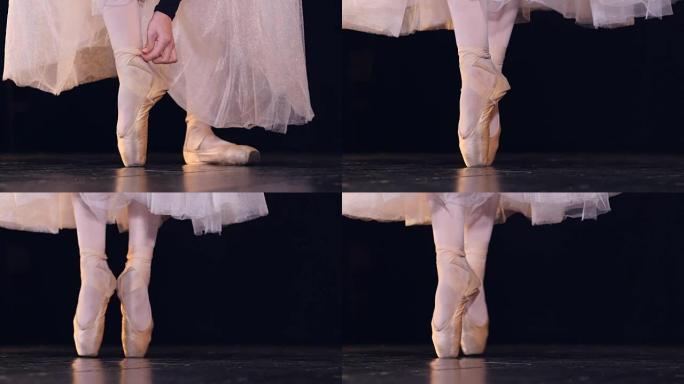 站在脚尖鞋上的未识别芭蕾舞女演员的特写镜头。高清。