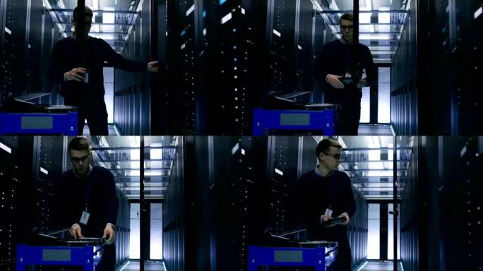 服务器工程师更换机架服务器开放式机柜中的硬盘。他在大数据中心工作。