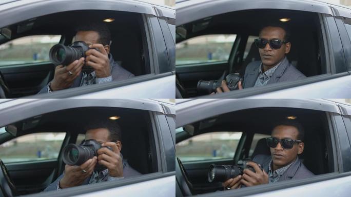 私人侦探男子坐在车内，用单反相机拍照