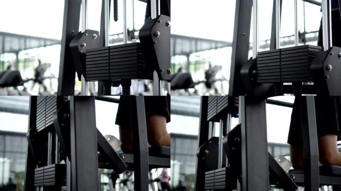 两张在健身房进行机器锻炼的特写镜头