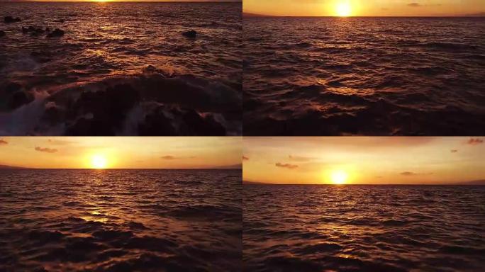 慢动作中惊人的戏剧性日落景色。空中射击在夏威夷的海洋上空低空飞行