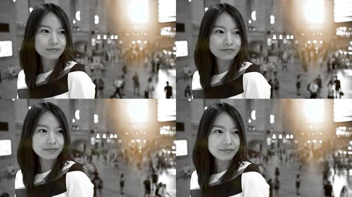 美丽的中国女人在外面玩的肖像。探索城市，微笑，快乐。