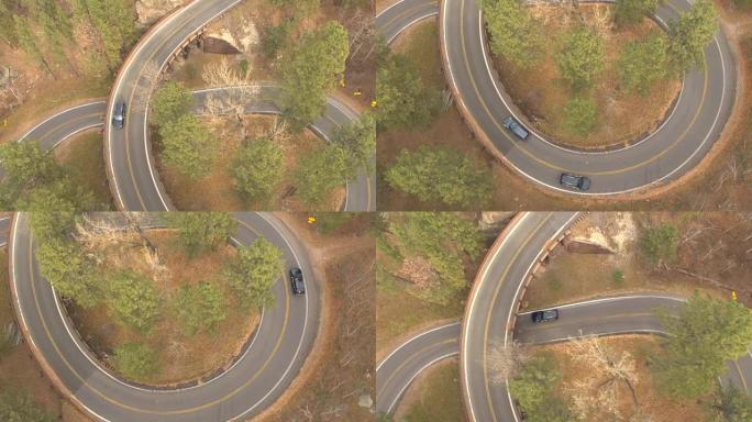 空中: 在南达科他州黑山的公路旅行中驾驶猪尾桥的汽车