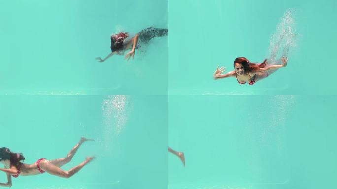 微笑的女人在水下游泳