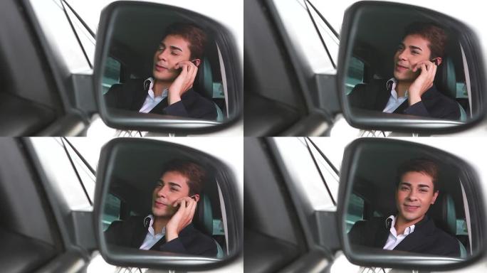 高清：开车的商人用手机聊天