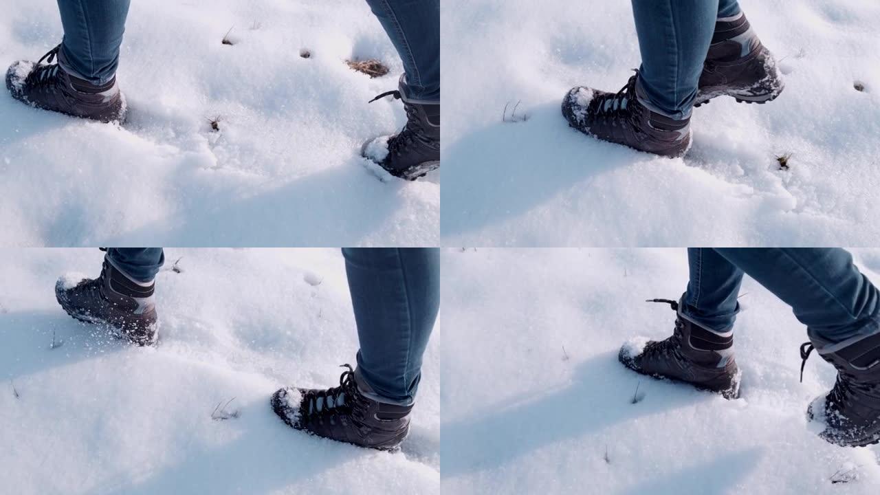 穿着靴子的徒步旅行者在雪地里行走，超级慢动作