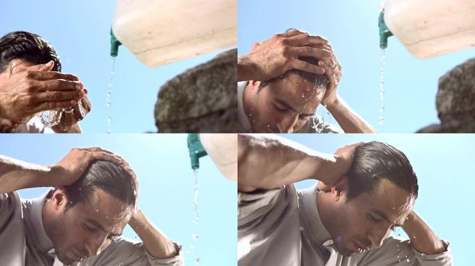 高清超级慢动作: 穆斯林男子在沐浴过程中