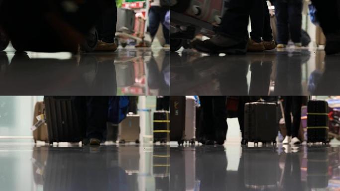 带行李的人在机场散步