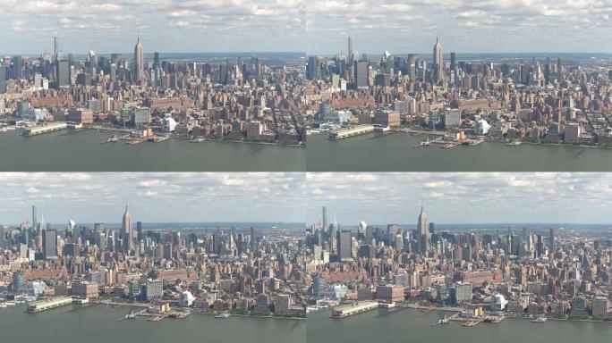 空中拍摄:阳光明媚的一天，观光直升机在纽约市上空盘旋