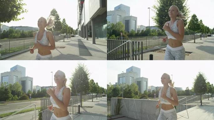 慢动作特写镜头耀斑: 阳光明媚的日子里，微笑的女人在城市慢跑