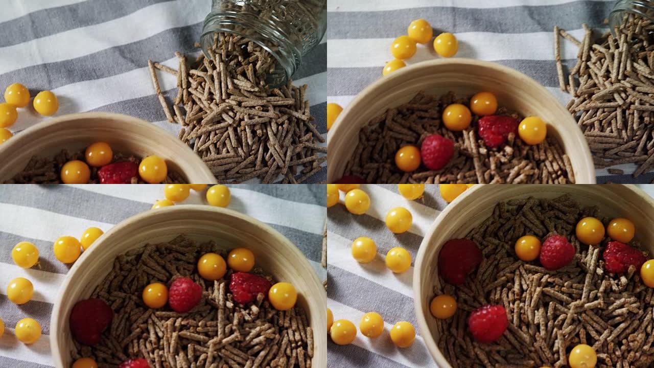 一碗谷物麸皮棒，配以金色浆果和覆盆子4k