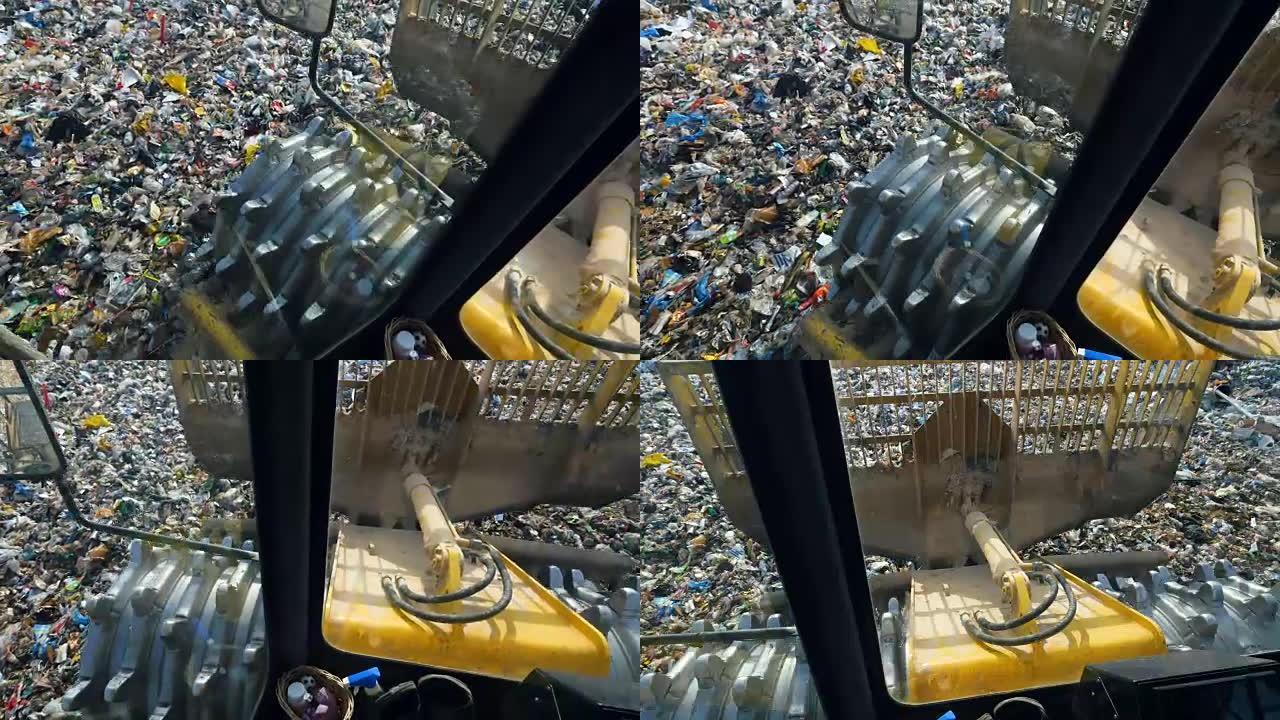 在城市垃圾场工作的推土机，兰迪尔。出租车上的景色。