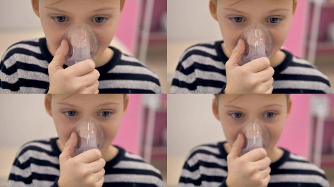 一个使用吸入器面罩的男孩的特写镜头。