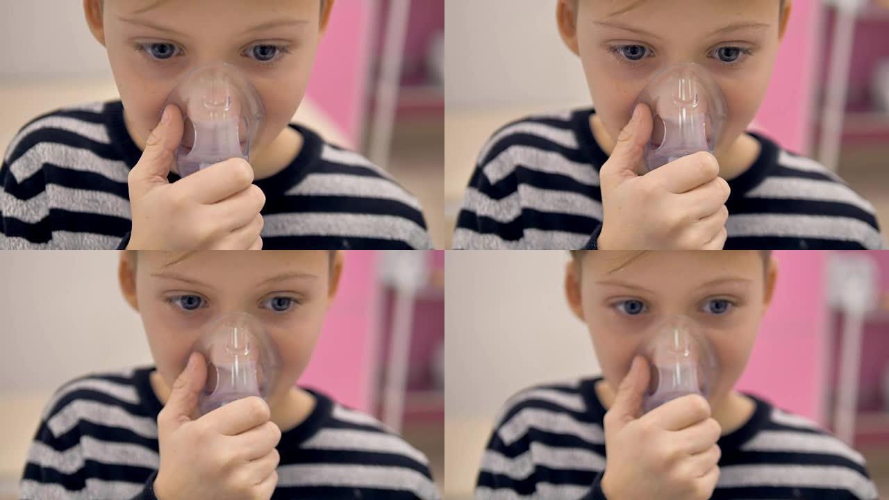 一个使用吸入器面罩的男孩的特写镜头。