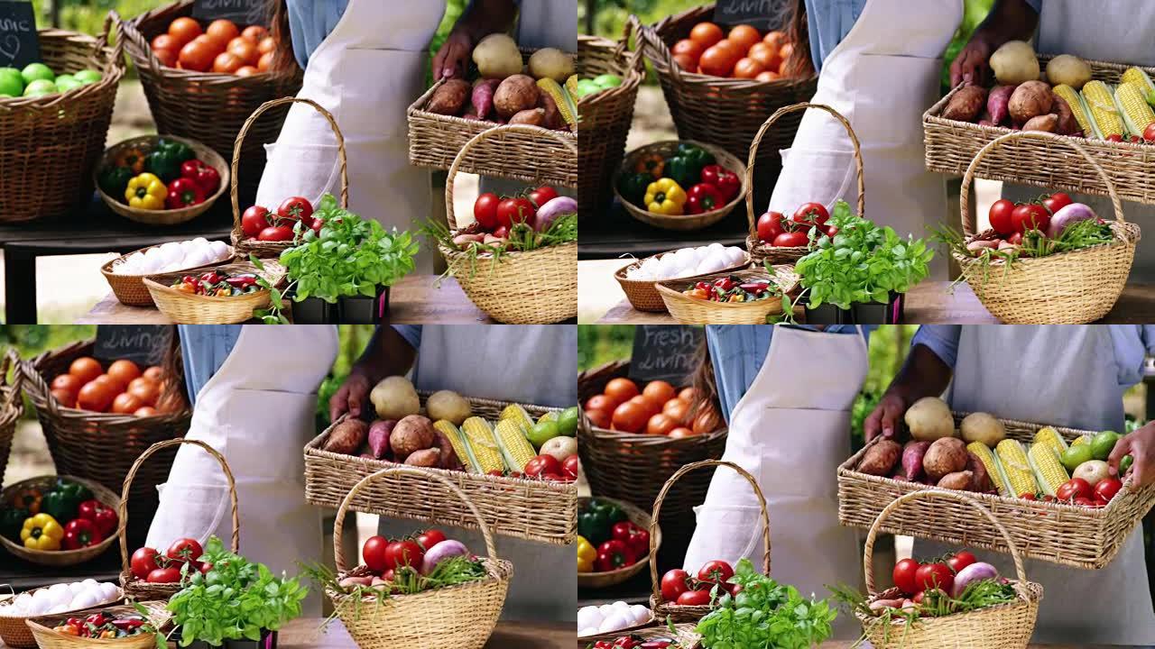 夫妇在篮子里拿着新鲜蔬菜的中间部分