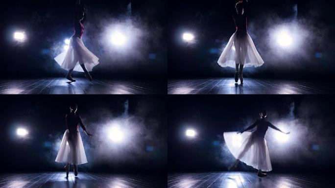 芭蕾舞女演员在黑暗中脚趾跳舞