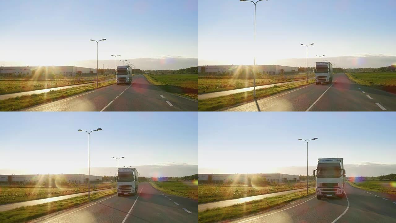 带货物拖车的白色半卡车在高速公路上行驶，背景是美丽的阳光明媚的风景。