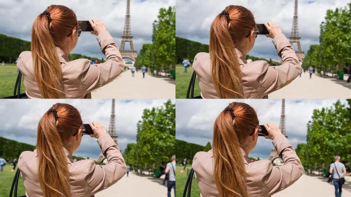 战神花园中的女人为埃菲尔铁塔拍照