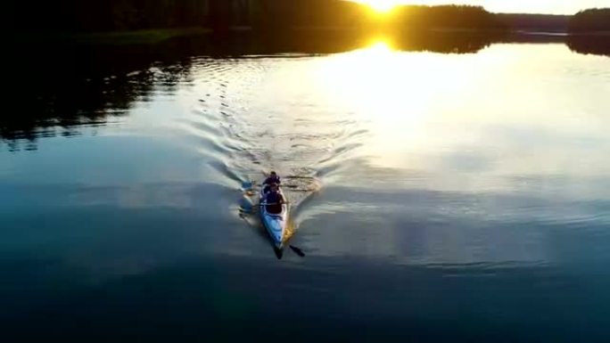 Summer relaxing activity. Kayaking during sunset