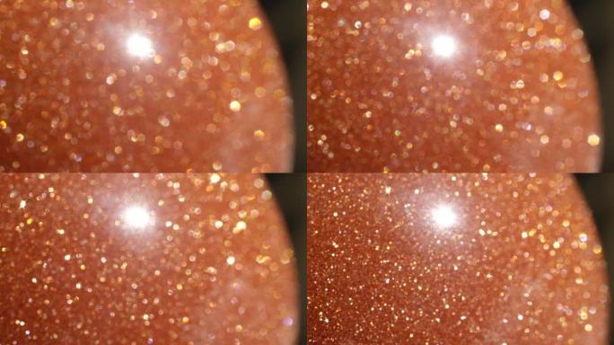 微距dop: 橙色半宝石太阳石宝石进出相机焦点。