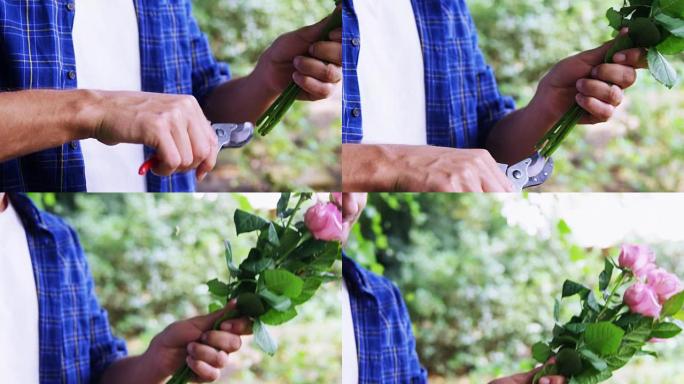 男人在花园里剪花茎