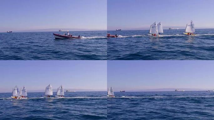 4k船在阳光明媚的蓝色海洋上驶过小艇，实时