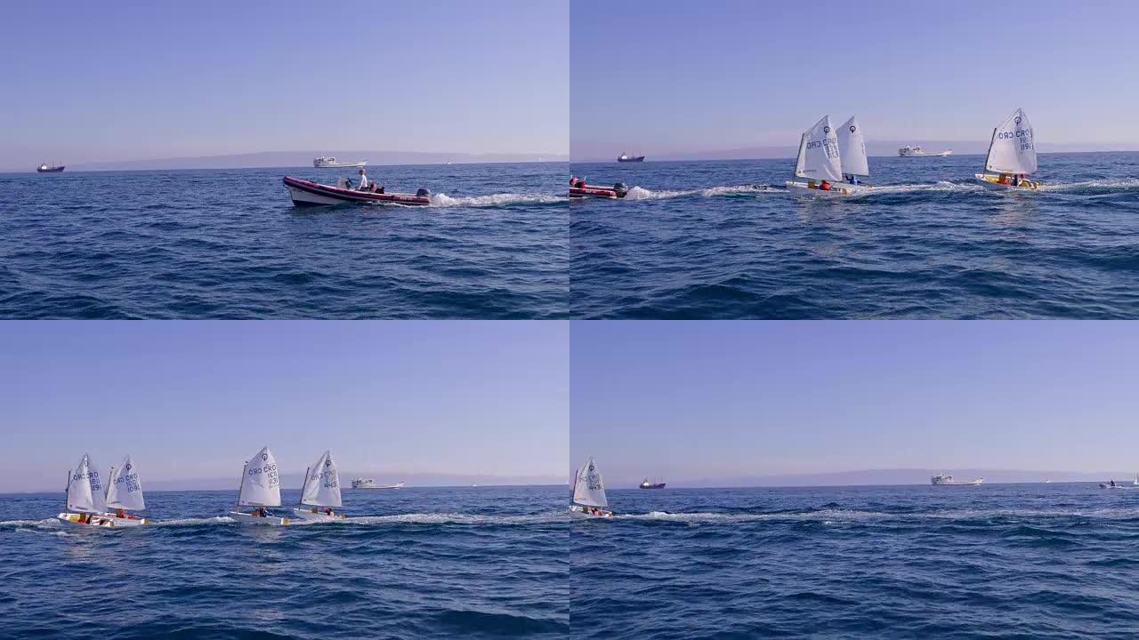 4k船在阳光明媚的蓝色海洋上驶过小艇，实时