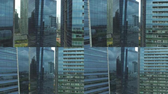 空中特写: 摩天大楼玻璃状的外部在日光下闪闪发光