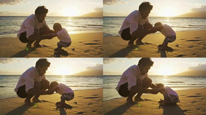 年轻的爸爸在海滩上与宝贝儿子玩耍