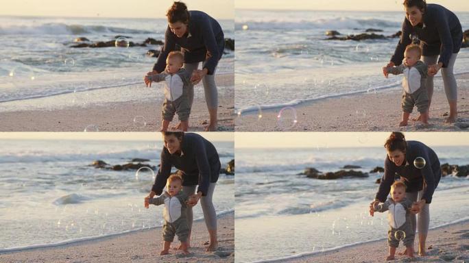 母亲和男婴在海滩上玩耍4k