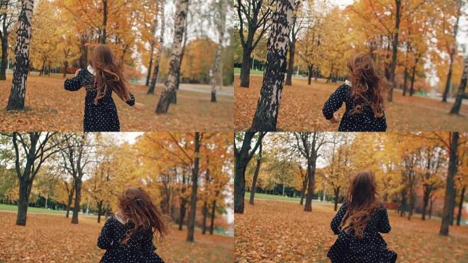 后视图可爱的卷发小女孩，穿着圆点连衣裙，在公园慢动作的秋天小巷里奔跑
