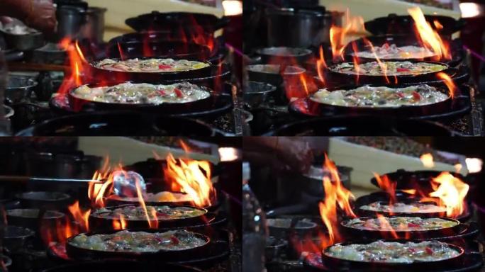 4k特写镜头烹饪炒虾，用平底锅在平底锅上的铁锹炒，泰国传统食品