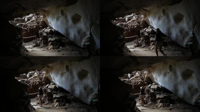 女探险家正在勘察洞穴
