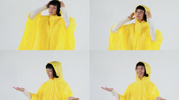 穿着黄色雨衣的女人打着手势感受雨4K 4k
