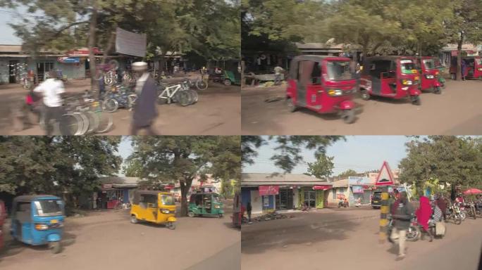 特写: 五颜六色的空嘟嘟车停在非洲城市肮脏的街道上