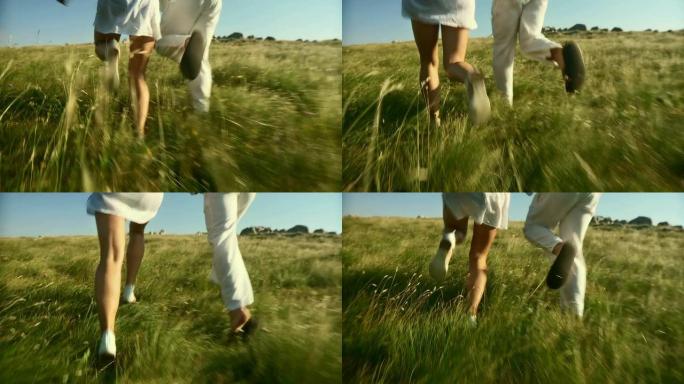高清慢动作: 情侣在草地上奔跑