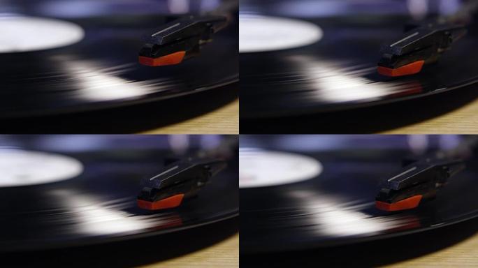 触控笔降低到黑胶唱片，并提高，特写，在R3D上拍摄
