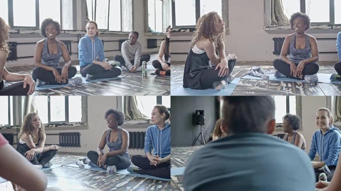 年轻女性在瑜伽课上聊天