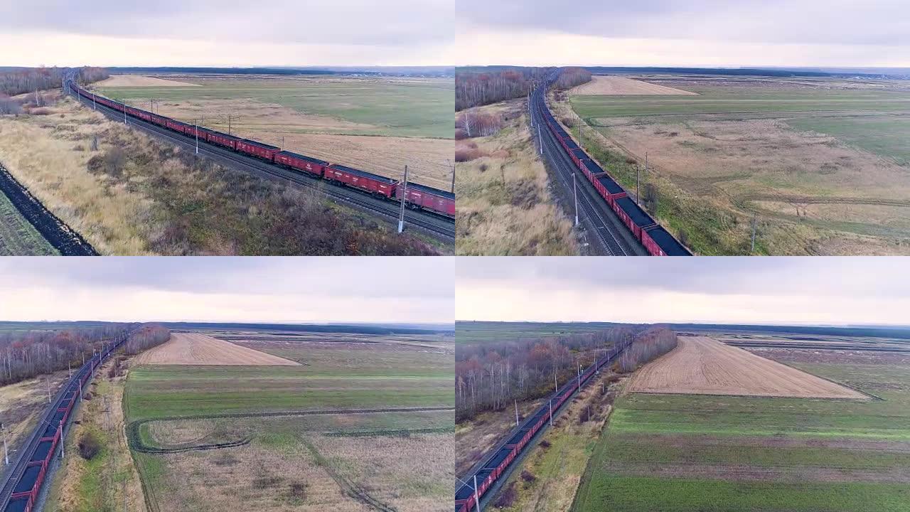 航空摄像机跟随运煤的货运火车。